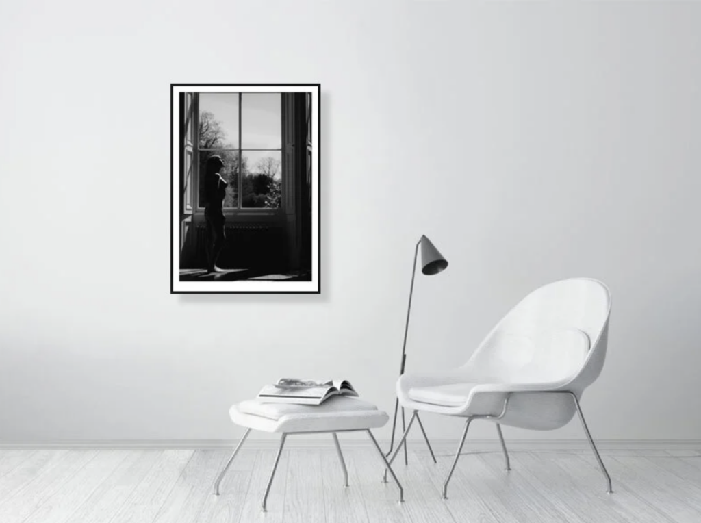 Framed wedding photograph displayed as fine art in a modern interior